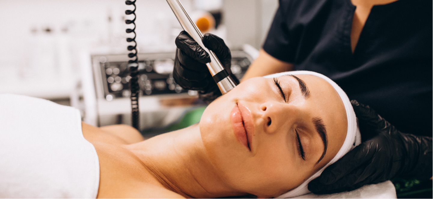 Woman receiving IPL treatment in a medspa.